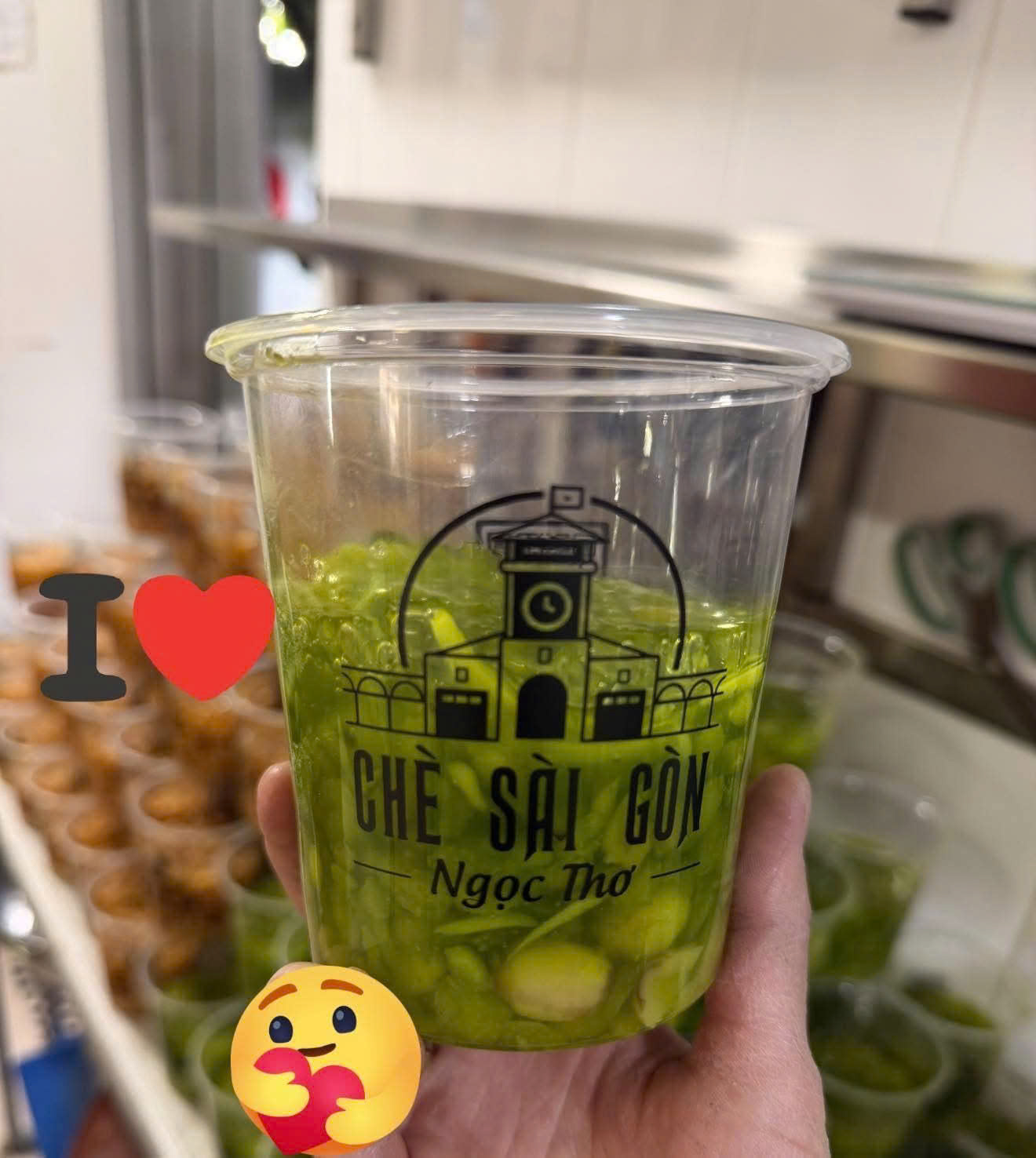Green Che Sai Gon dessert cup held in the kitchen