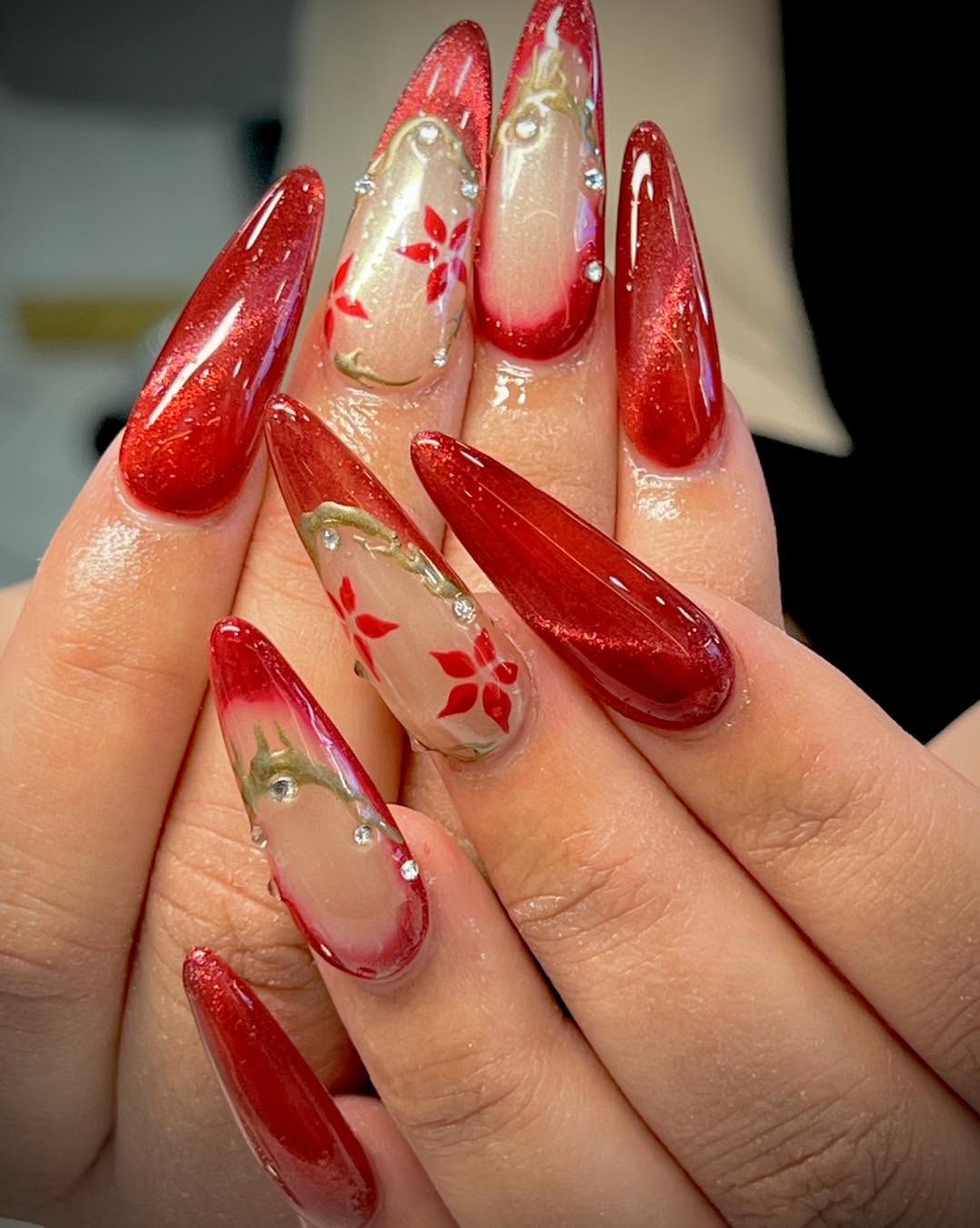 Red almond nails with glossy sculpted accents