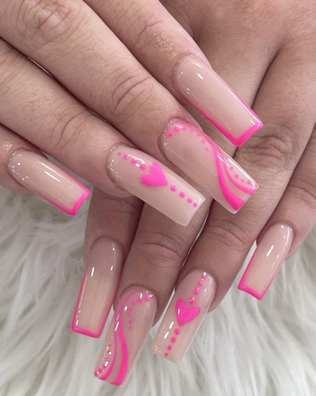 Pink French nail extensions with tiny heart accents