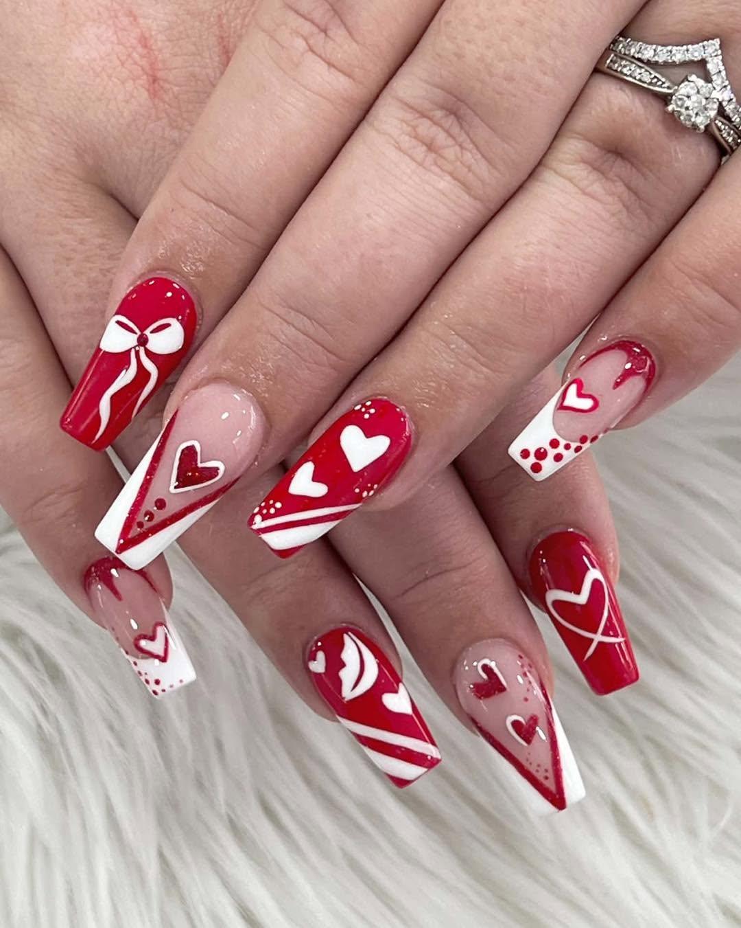 Red and white statement nails with heart detail