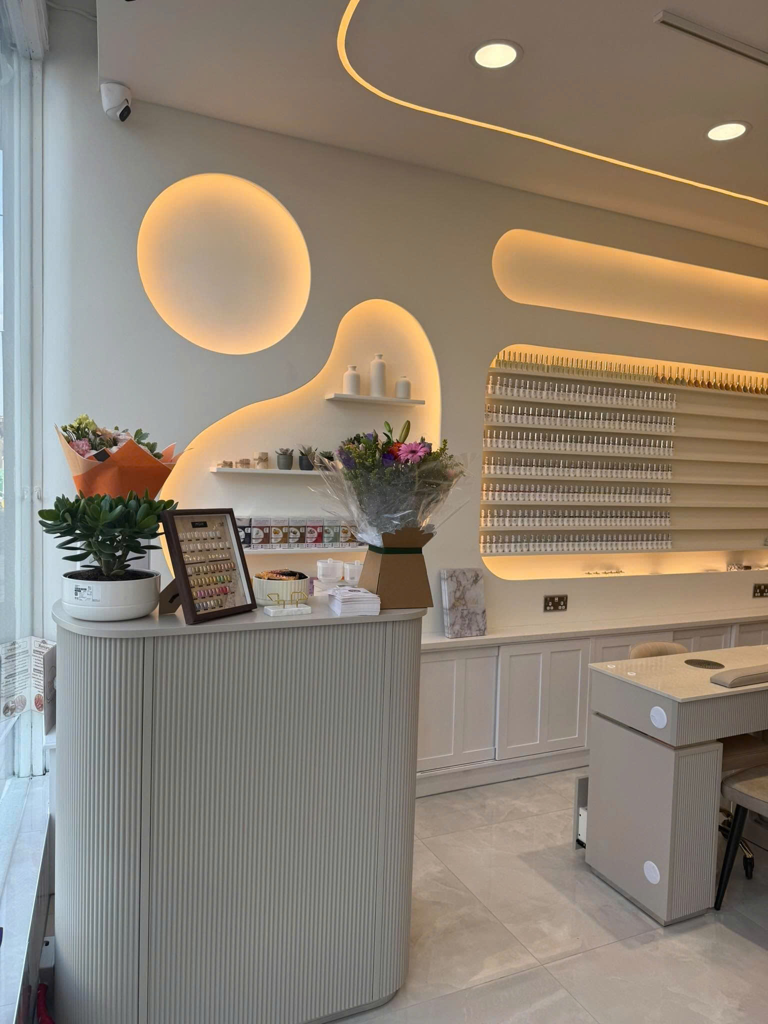 The Nail Lounge reception and nail colour display