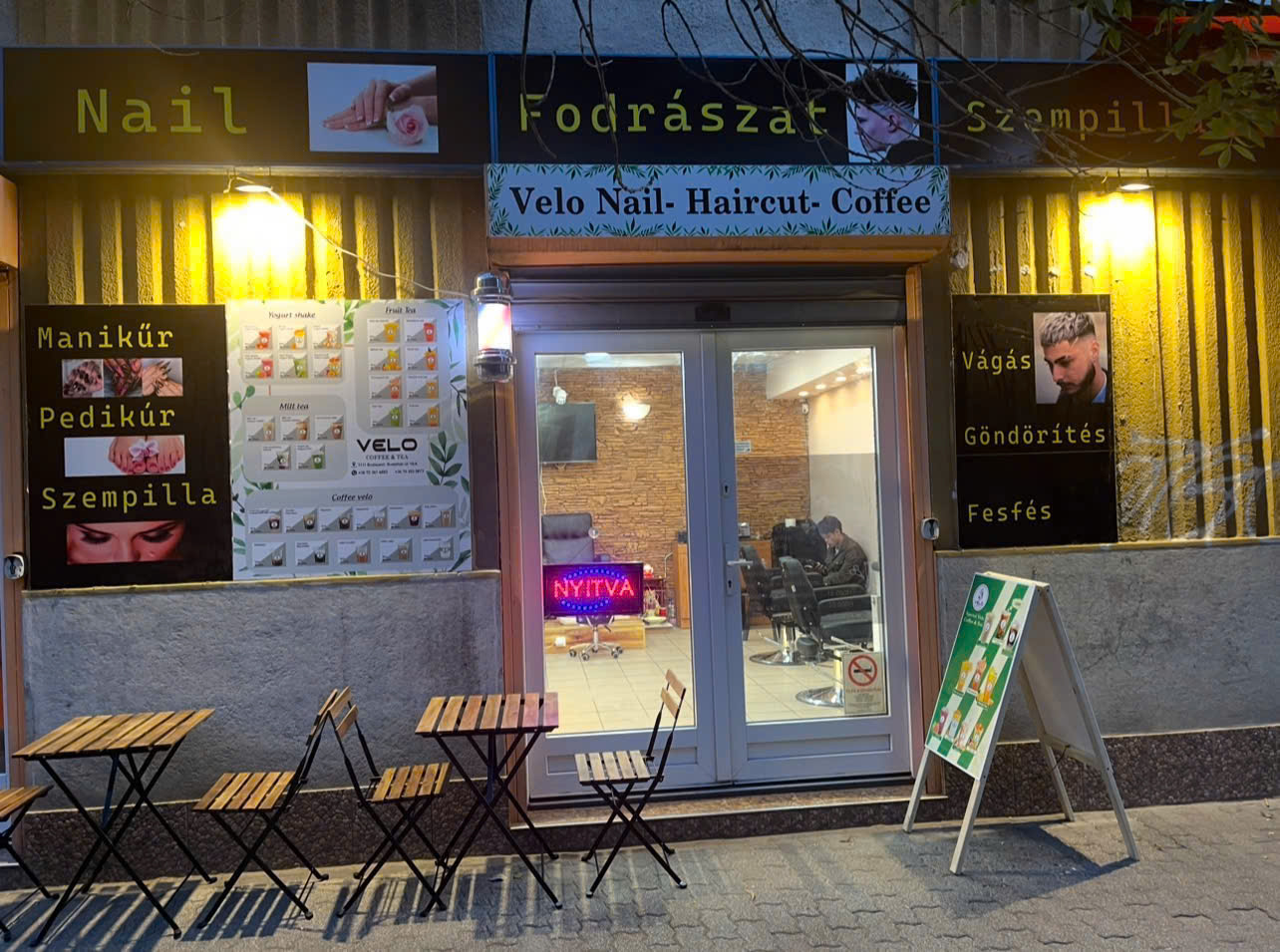 Velo Nail storefront at night