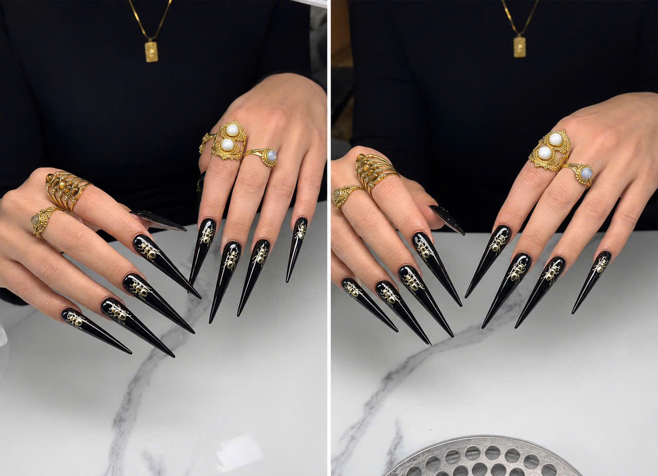 Black long nail extensions with gold details